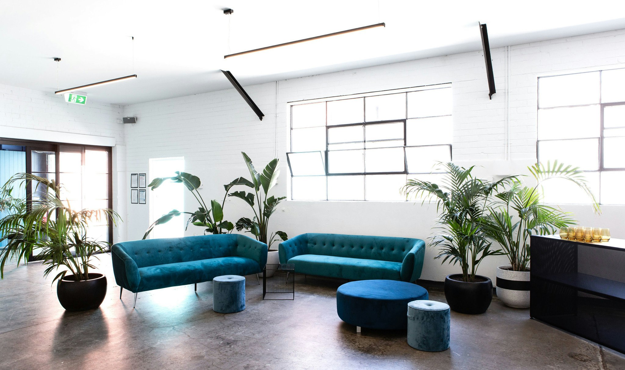 Main room of an event space, styled for a wedding reception.
